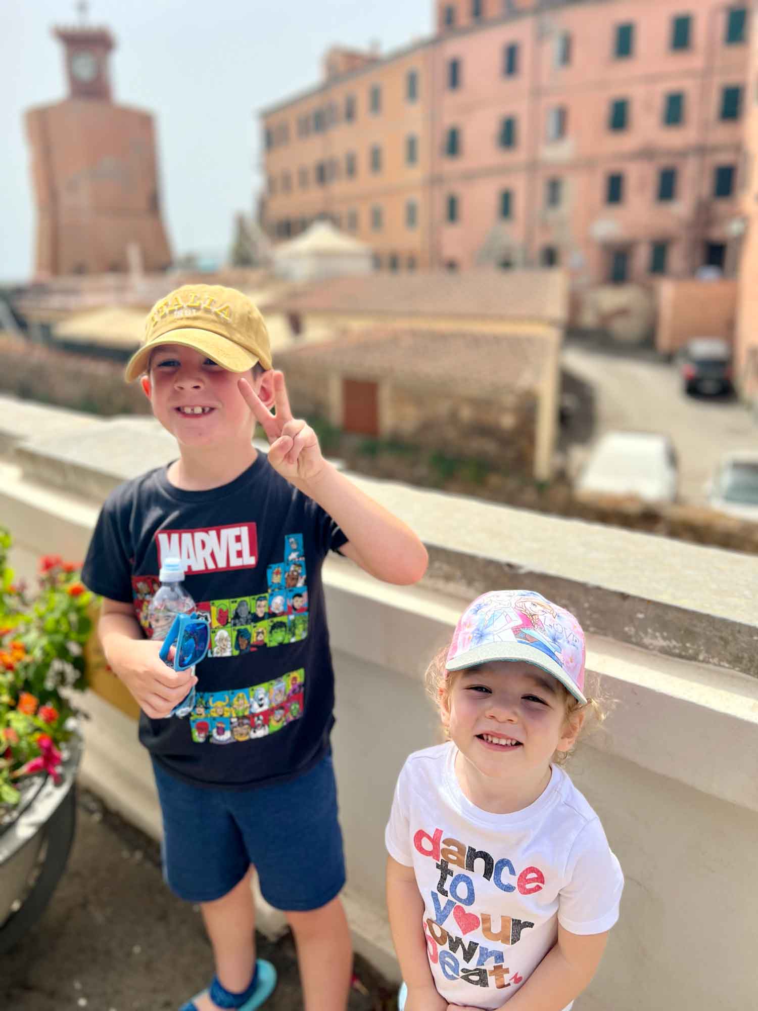 two kids looking at the camera in hats