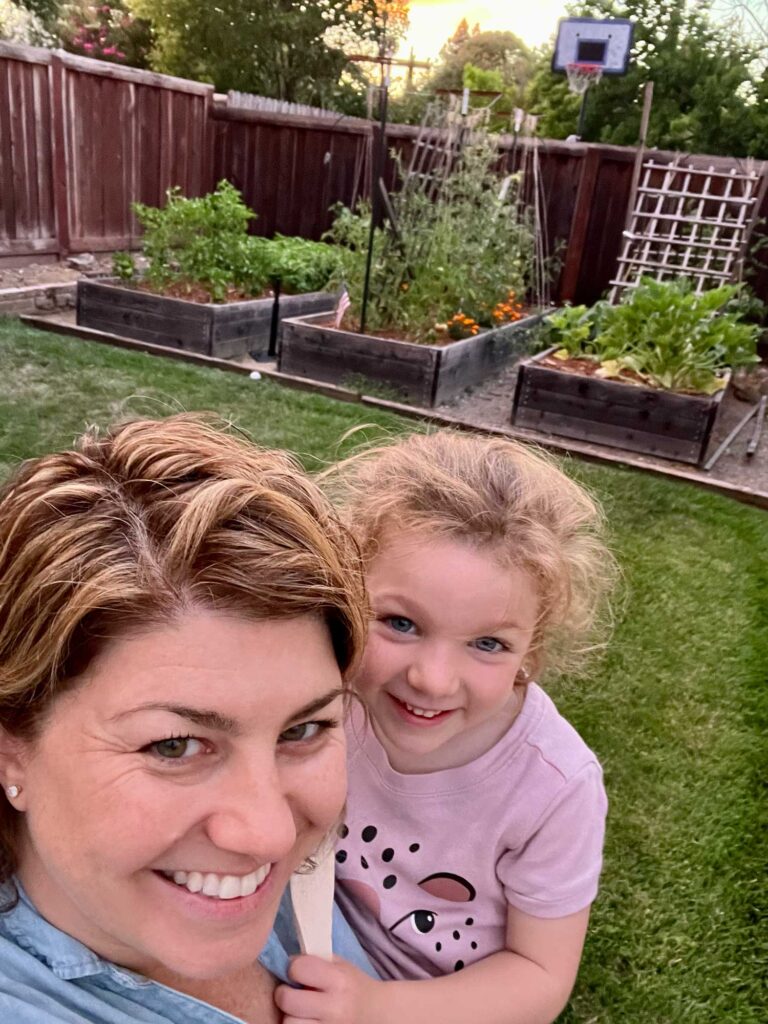 mother and daughter selfie in the backyard