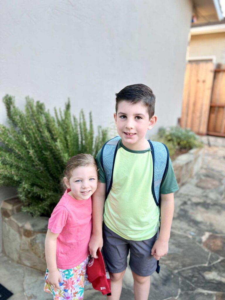 two kids ready for the first day of school